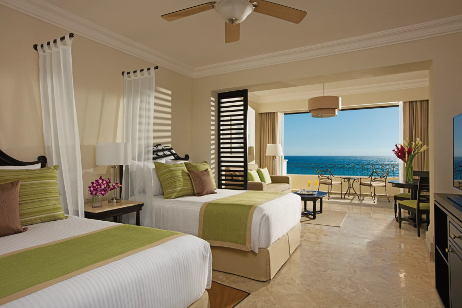 Sea facing bedroom interior at Dreams® Los Cabos Suites Golf Resort & Spa