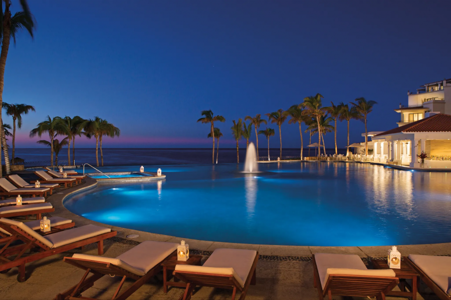 Night pool view at Dreams® Los Cabos Suites Golf Resort & Spa